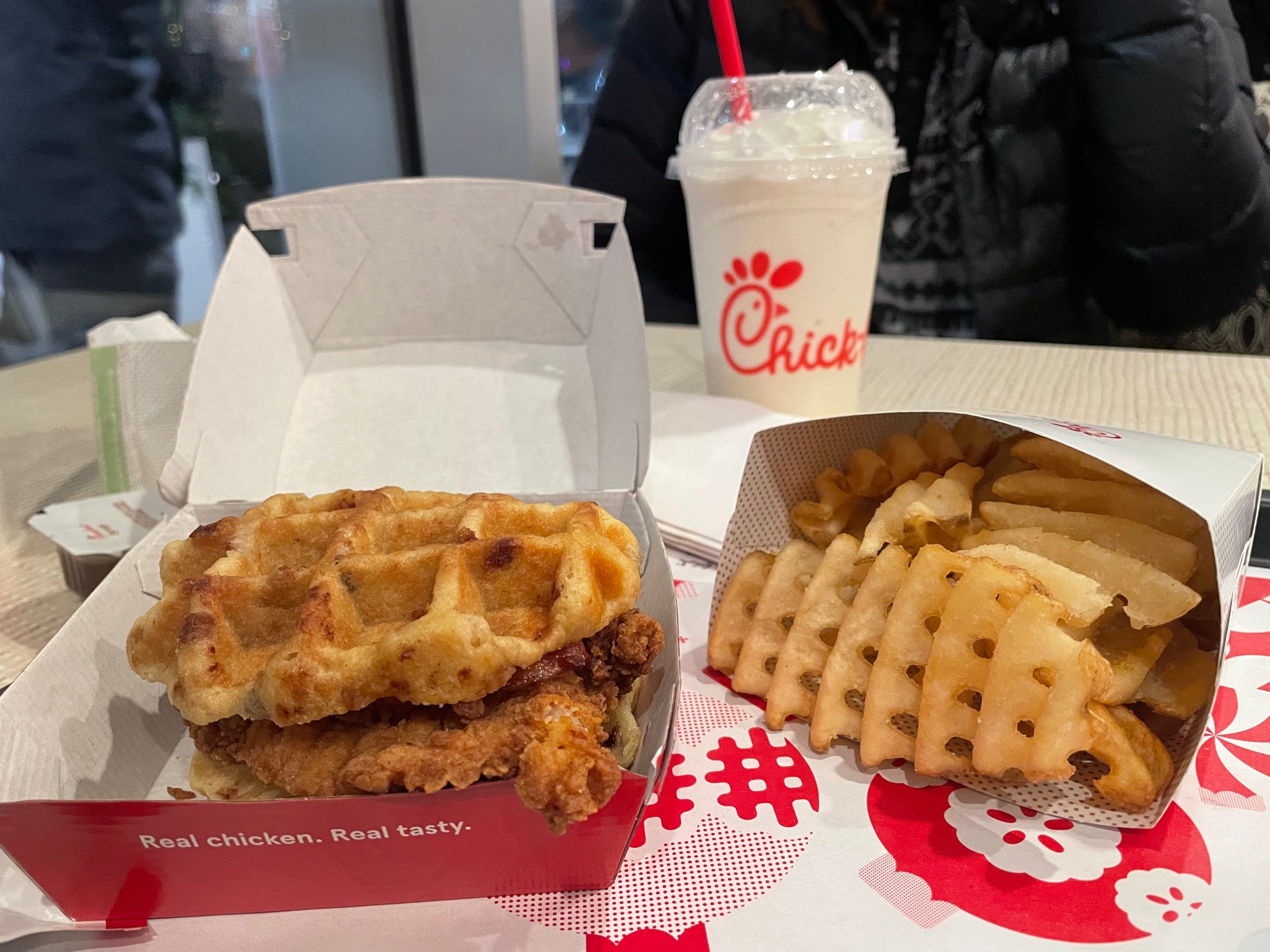 Stacking Chick-fil-A’s trial chicken and waffles sandwich against a Baltimore classic
